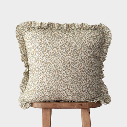Beige and white floral patterned cushion cover with ruffled edges on all sides.