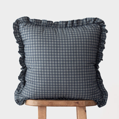 Navy gingham cushion cover with ruffled edges on all sides.