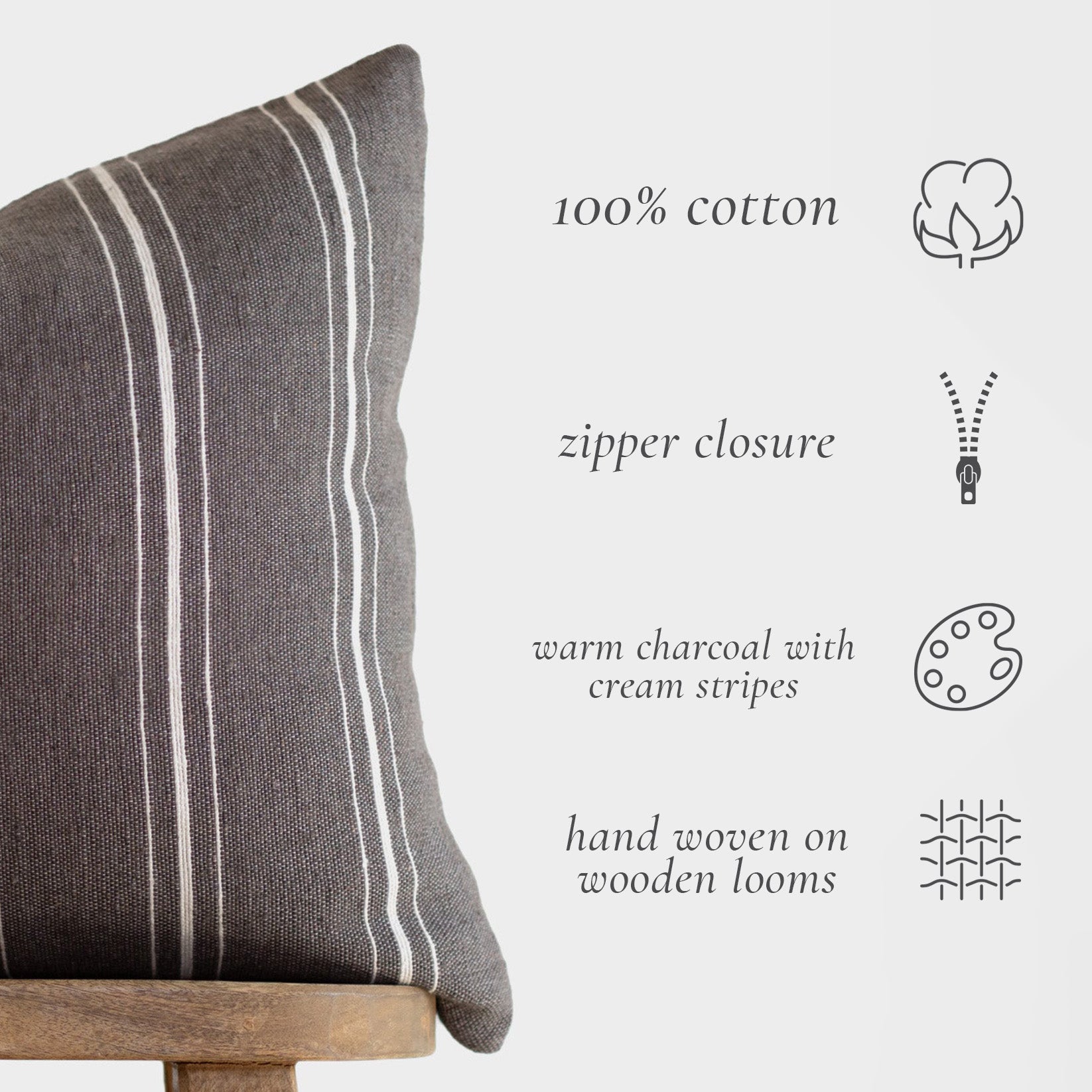Warm charcoal lumbar pillow with cream vertical stripes and zipper closure.