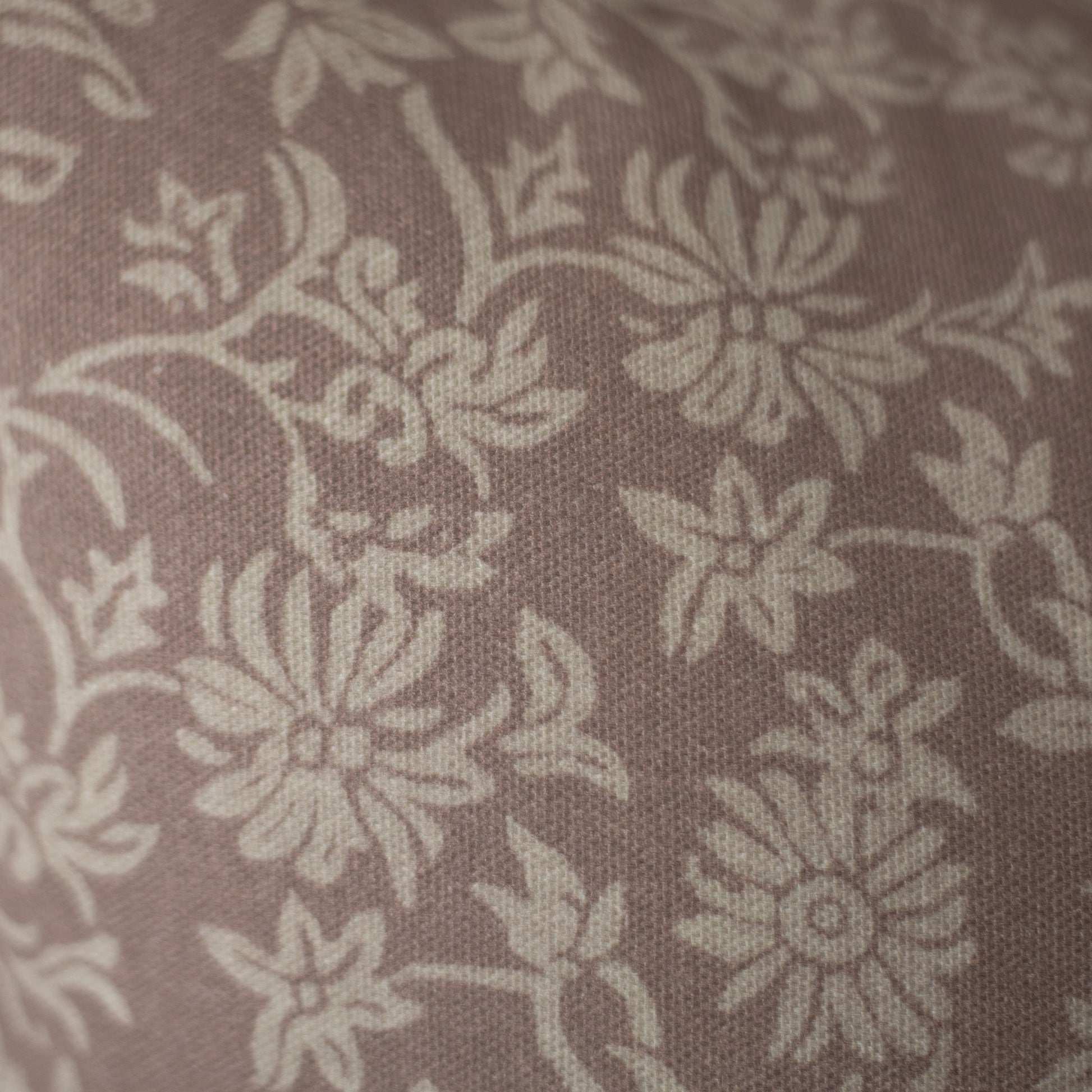 Taupe damask patterned fabric with cream floral motifs on textured woven material.