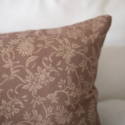 Taupe linen pillow with cream floral damask pattern.