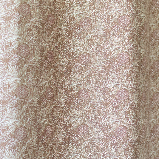Beige curtain panel with botanical print featuring pineapples and feathered leaves in a repeating pattern.