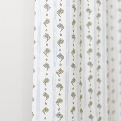 White curtain panel with vertical stripes and gold floral bouquet pattern throughout.