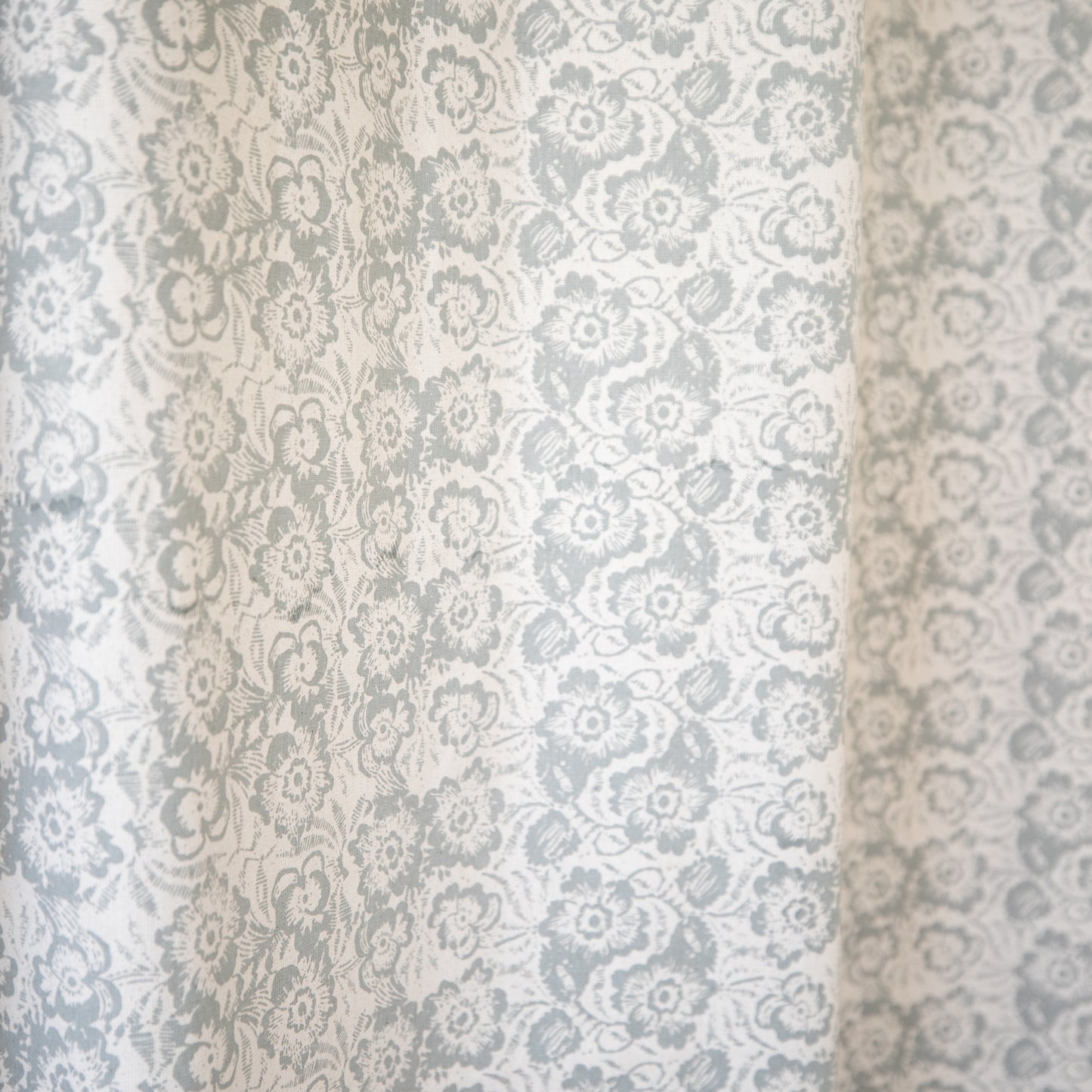 Two sheer curtain panels with gray and white damask floral pattern, 52" x 96".