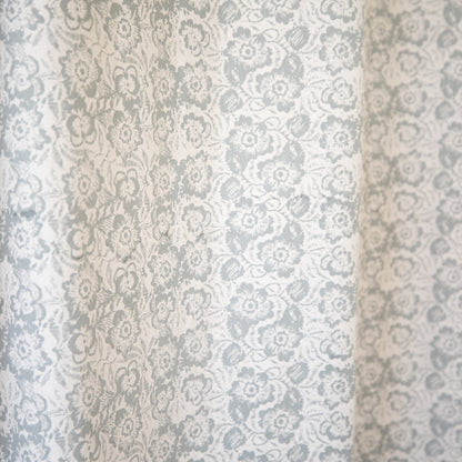 Two sheer curtain panels with gray and white damask floral pattern, 52" x 96".