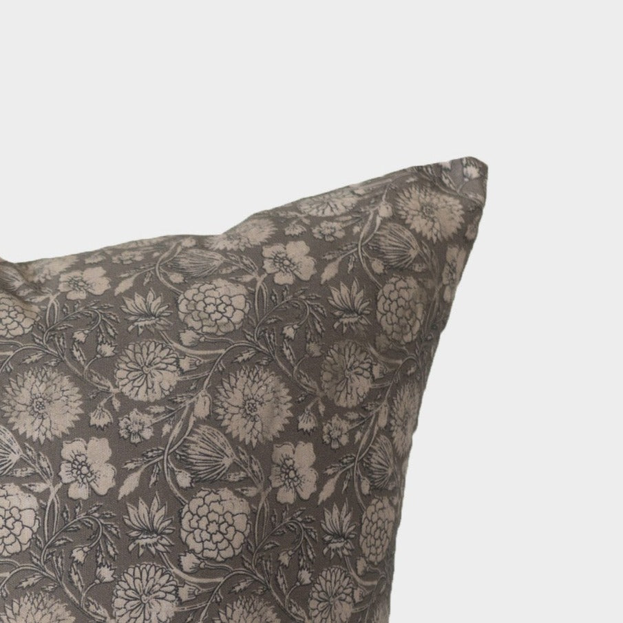 Charcoal and cream floral patterned pillow with botanical print design.