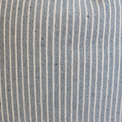 Blue and white striped woven textile with vertical lines in a regular pattern.