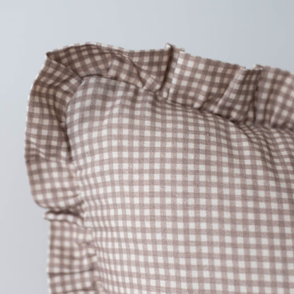 Tan and white mini gingham fabric with ruffled edge detail.