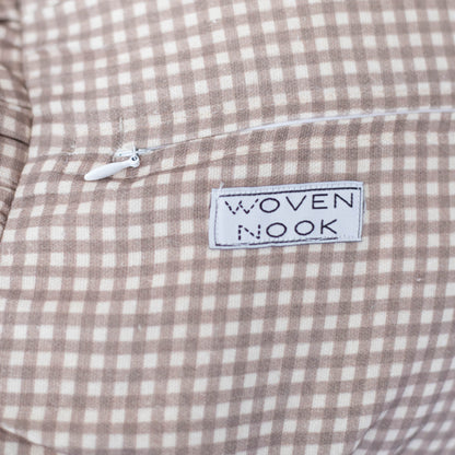 Tan and white mini gingham check fabric with "Woven Nook" brand label and drawstring detail.