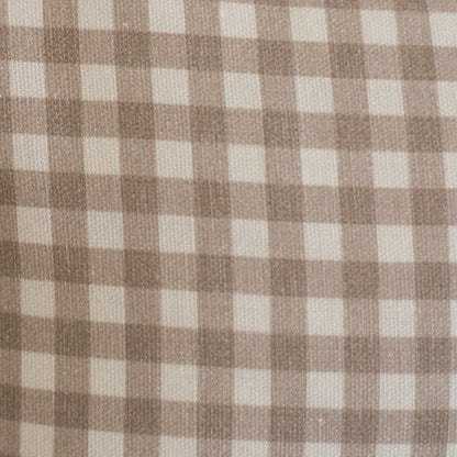 Tan and cream gingham check pattern on woven lumbar pillow fabric.
