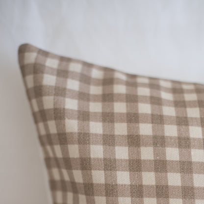 Tan and cream gingham check lumbar pillow cover with woven texture.