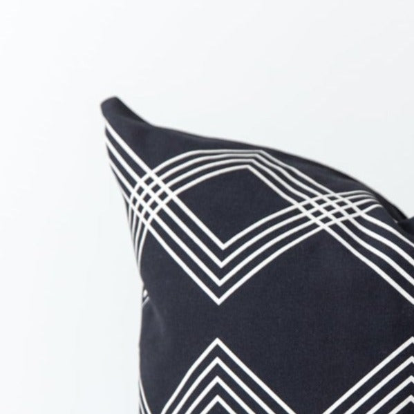 Four dark blue nesting bowls with white geometric stripe pattern, 18 inches.