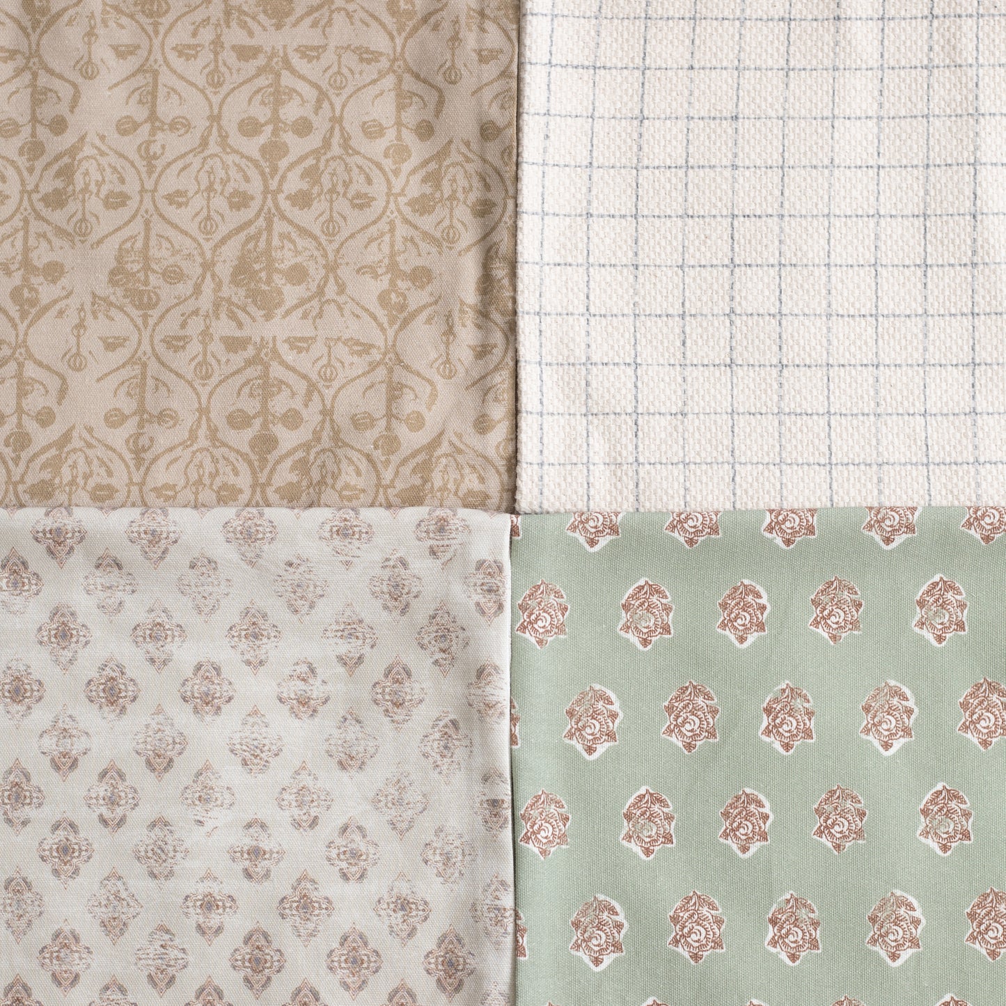 Four fabric swatches with damask and geometric patterns in beige, cream, white, and sage green.