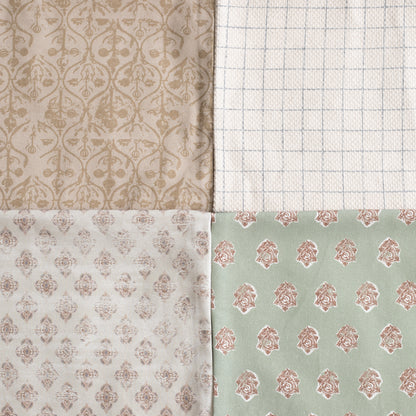 Four fabric swatches with damask and geometric patterns in beige, cream, white, and sage green.