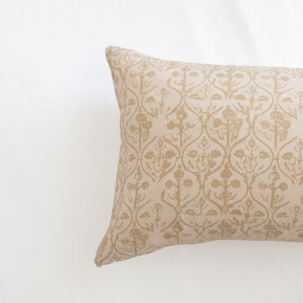 Rectangular pillow with cream and beige damask floral pattern throughout.