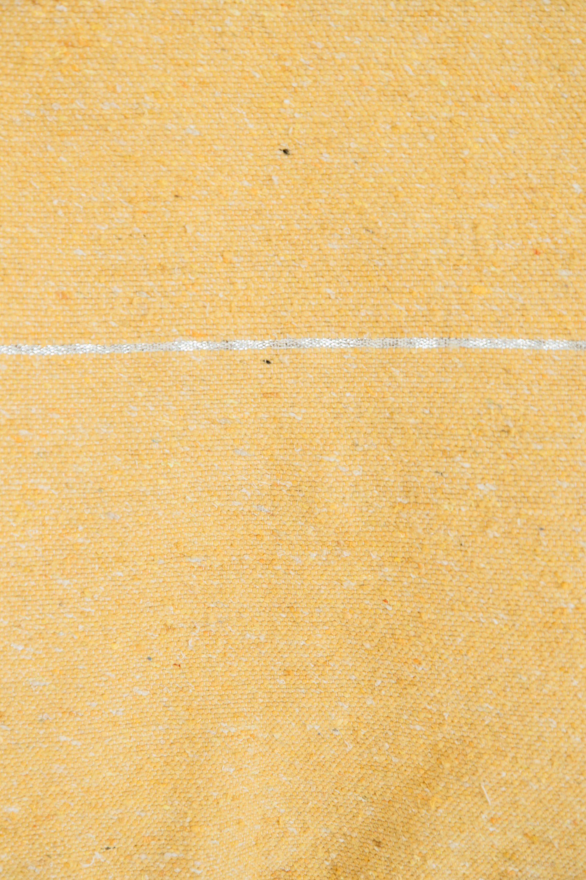 Yellow woven fabric with horizontal white stripe detail across the center.