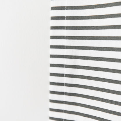 White curtain panel with evenly spaced horizontal gray stripes and center seam.