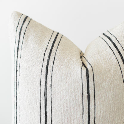 Cream and black striped pillow cover with vertical woven lines detail.