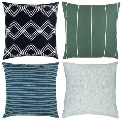 Four 18" throw pillows: black with white geometric diamonds, green with white vertical stripes, teal striped, and light gray 