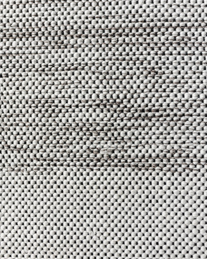 Cream and gray textured outdoor rug with dense woven pattern, 5x7 size.