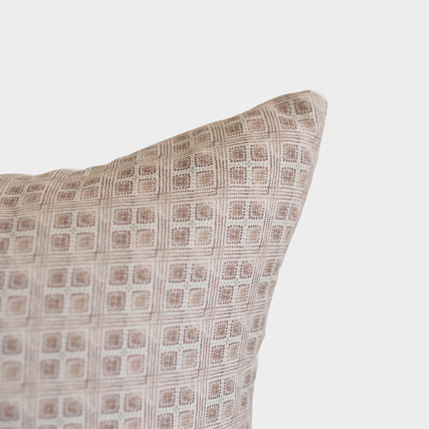 Brown and cream grid patterned Euro pillow with geometric floral motif design.
