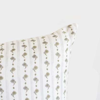 Cream lumbar pillow with sage green vertical stripes and floral motifs in alternating pattern.