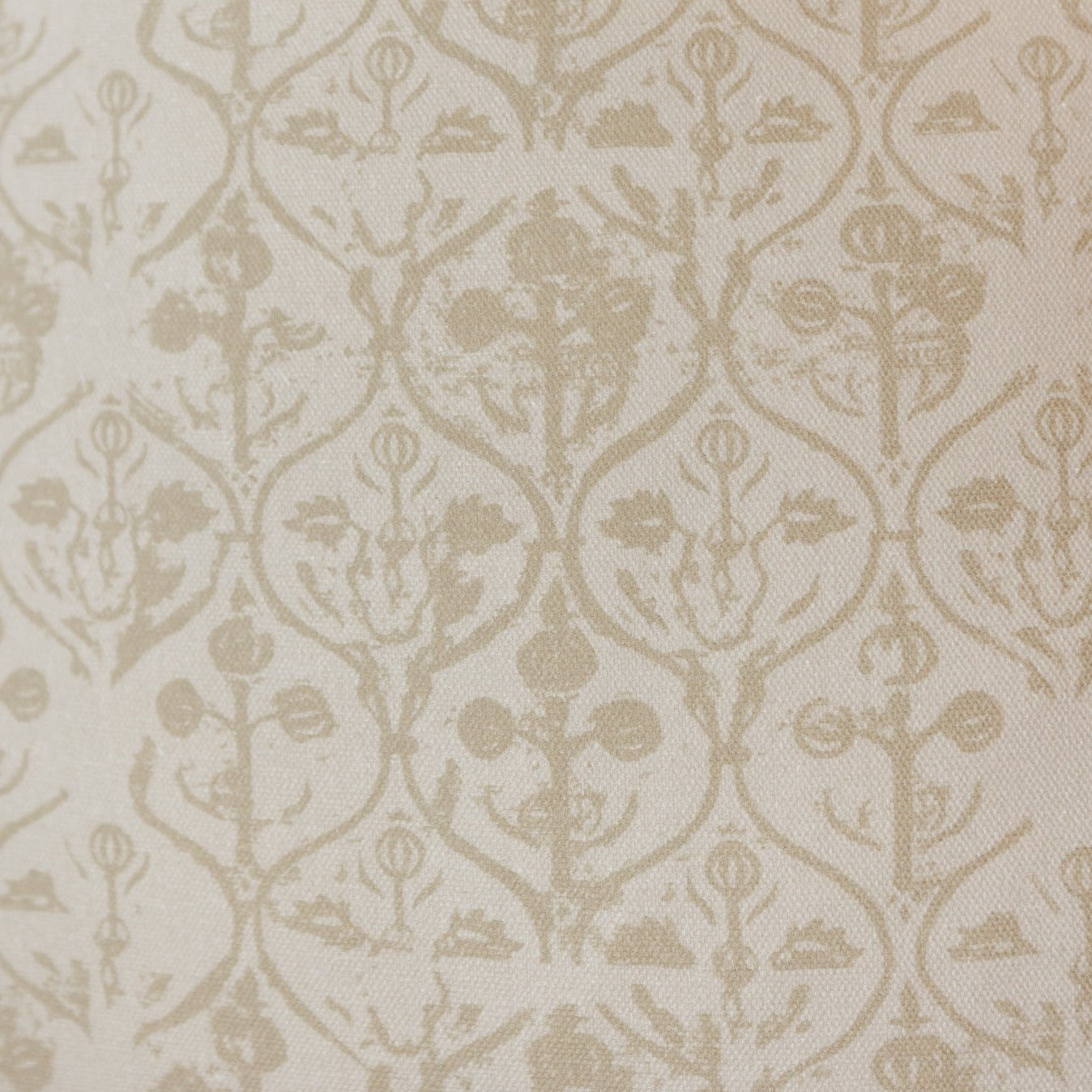 Cream and beige fabric with repeating hourglass and floral damask pattern throughout.