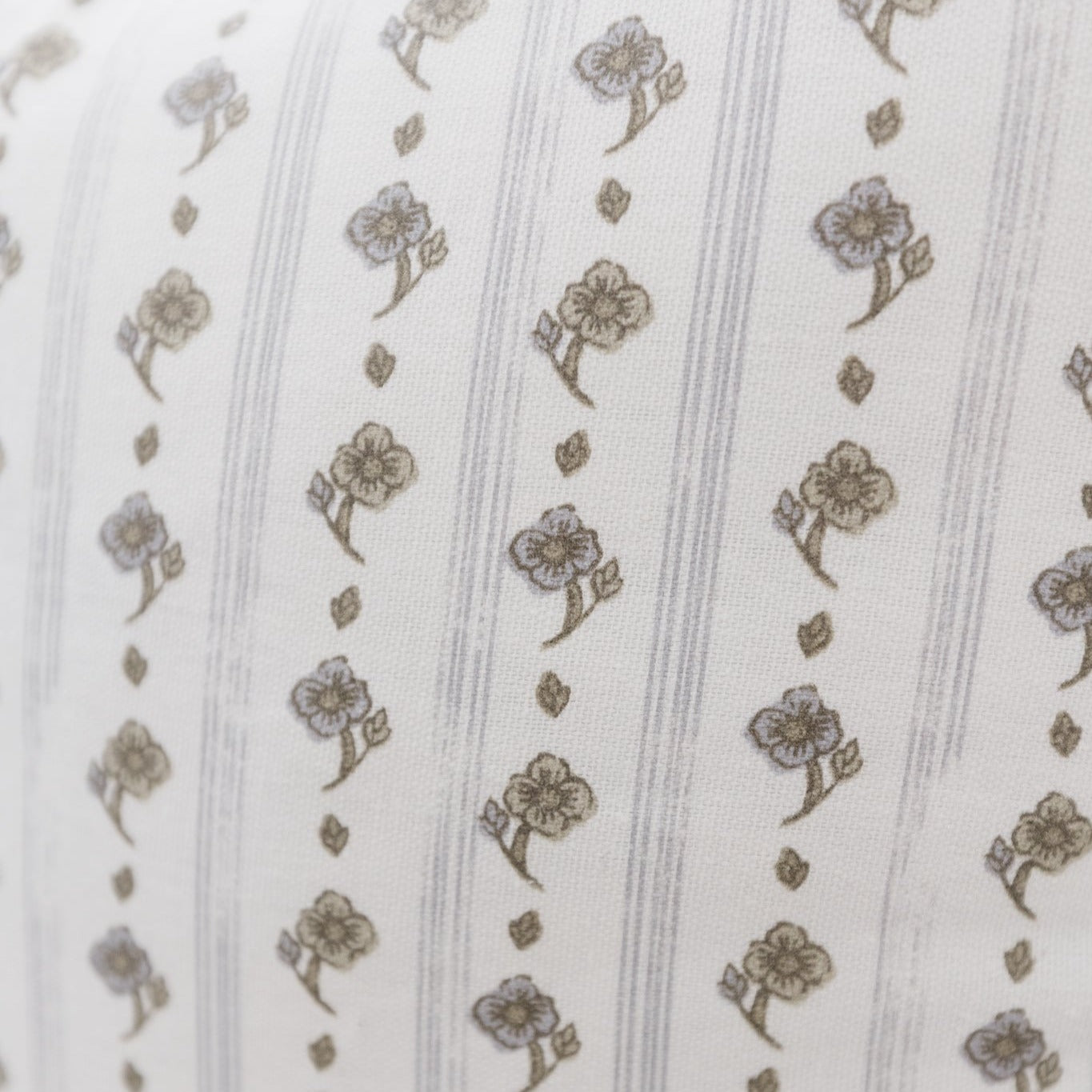 Cream fabric with tan floral motifs and vertical stripe pattern.