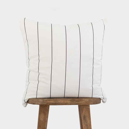 Cream cushion with black vertical pinstripes on wooden chair back.