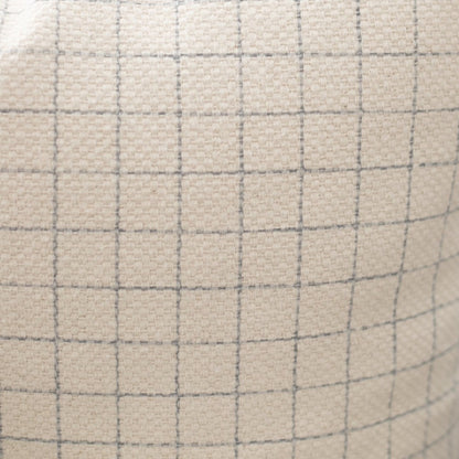 Beige lumbar pillow with gray grid pattern and quilted texture.